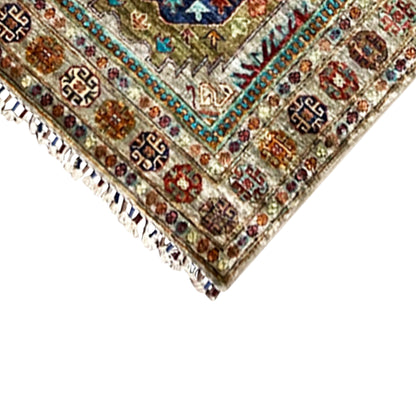Close-up of Khorjin runner: fringe along the edge and decorative border with ornaments