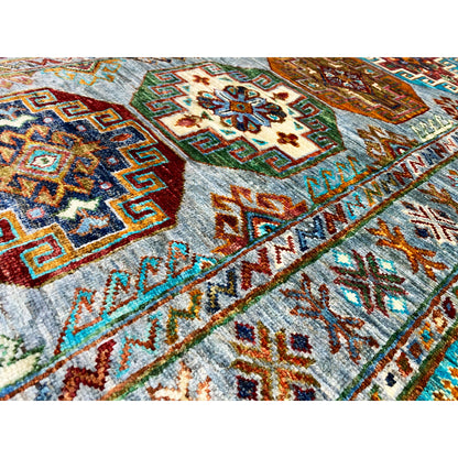 Close-up: Hand-knotted Khorjin runner with a colorful ornamental field and geometric patterns