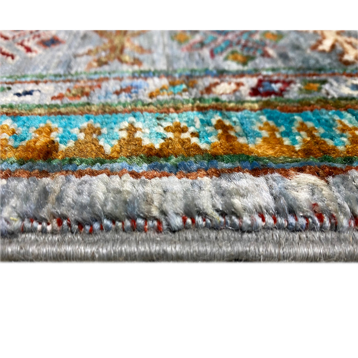 Close-up hem: Hand-knotted Khorjin runner with multicolored border and fringes