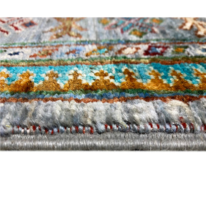 Close-up hem: Hand-knotted Khorjin runner with multicolored border and fringes
