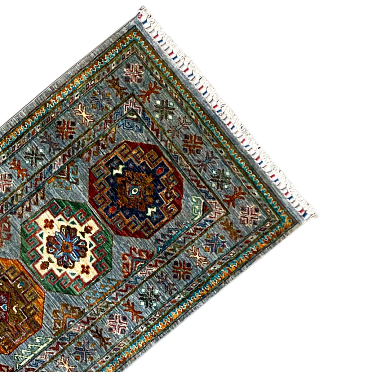 Corner of the hand-knotted Khorjin runner with geometric symbols and fringes