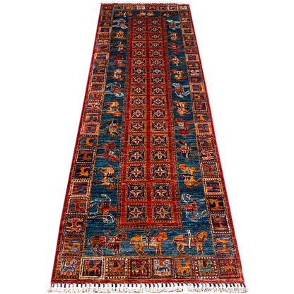 Hand-knotted Khorjin runner with a blue ground and rows of red ornaments, rectangular.