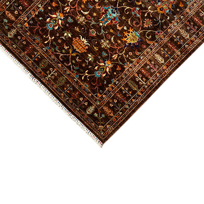 Corner and edge view of the hand-knotted Khorjin rug with fringed trim