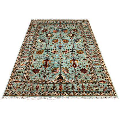 Rectangular turquoise Khorjin rug with an ornamental border and bird/floral motifs