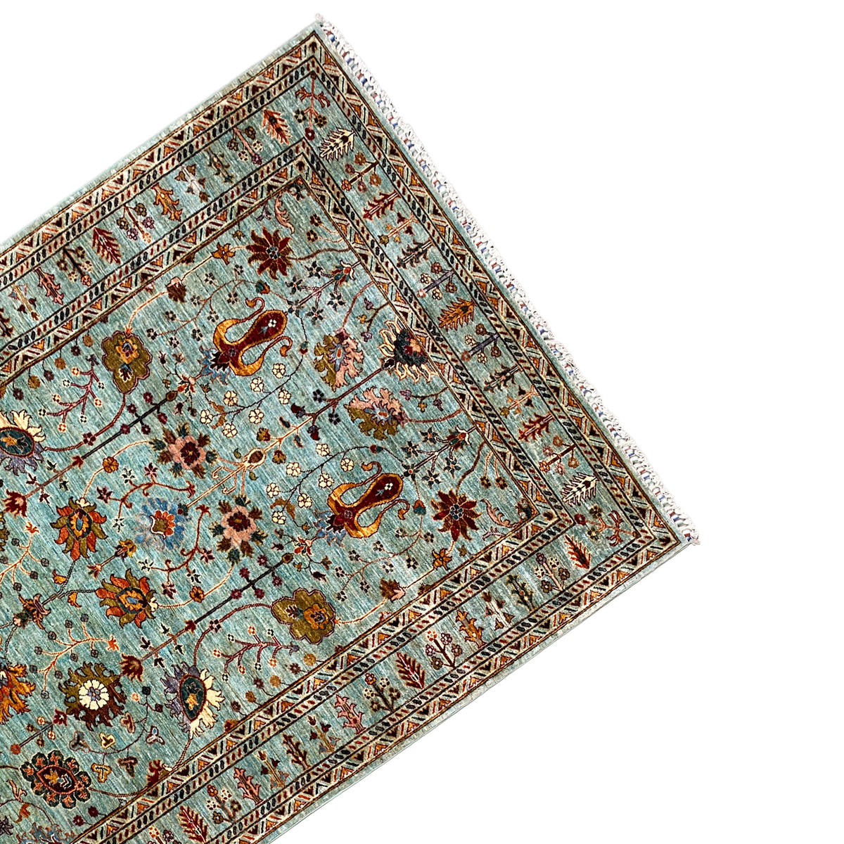 Oblique view of a Khorjin rug with a turquoise background and medallion borders