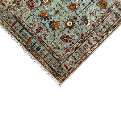 Edge and fringe of the Khorjin carpet: turquoise, multicolored ornaments and diamond patterns