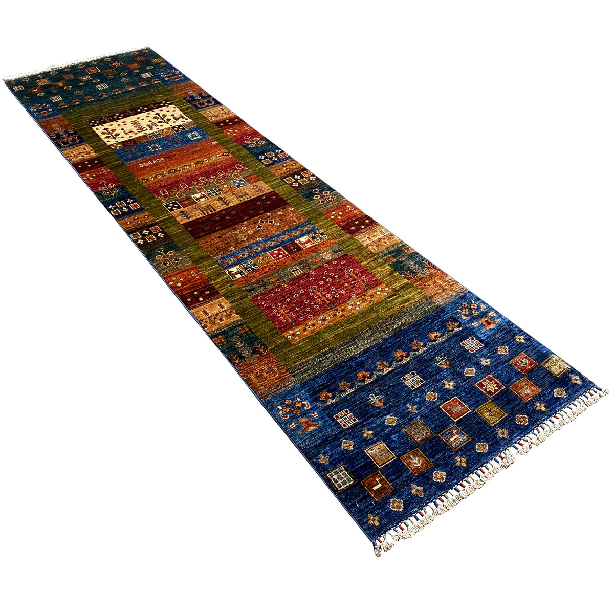 Hand-knotted runner rug displayed at an angle, dark blue tones with red and green stripes