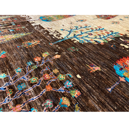 Hand-knotted Khorjin rug detail, brown woven texture with colorful tree and patterned areas