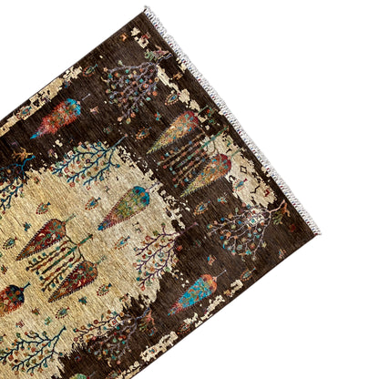 Hand-knotted Khorjin rug corner with fringed trim, brown field with beige motif