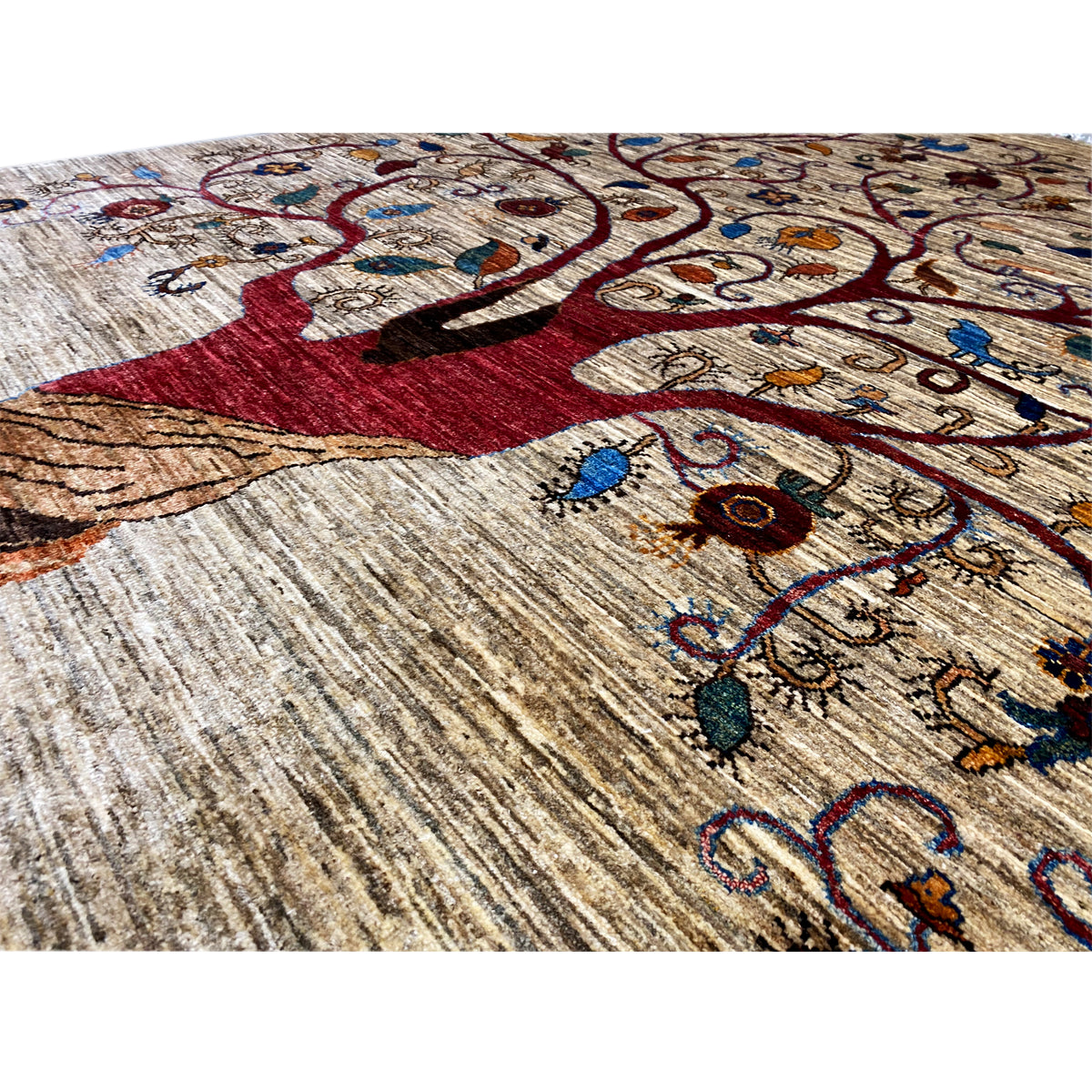 Detailed view: Tree of Life motif with floral embellishments, reddish-brown and blue accents