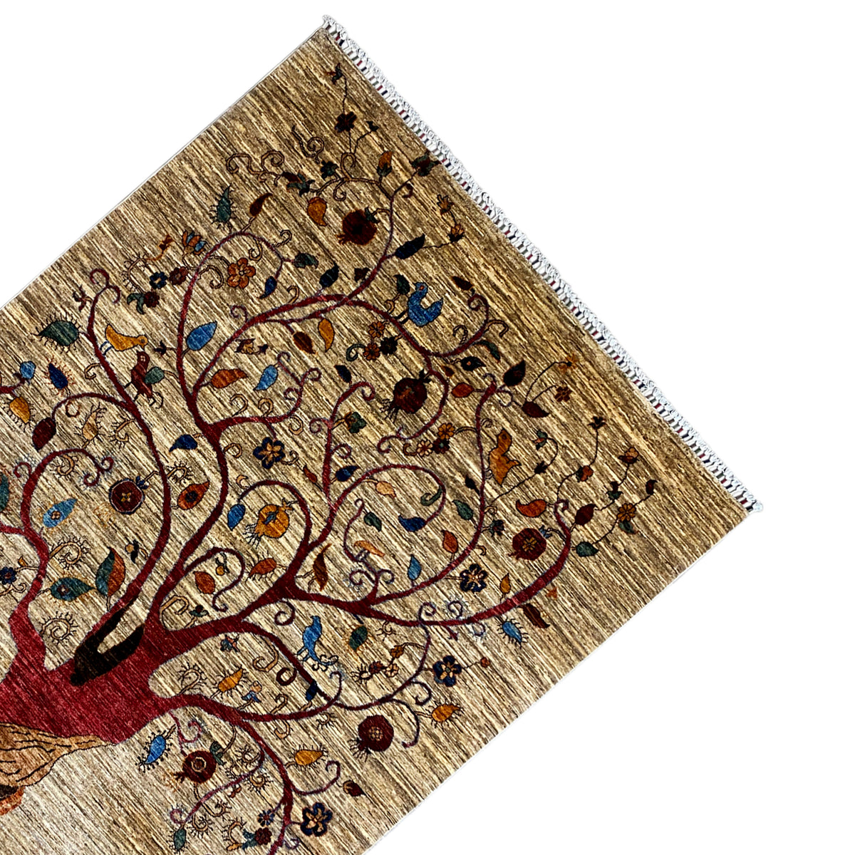 Corner of a hand-knotted rug with a tree of life motif and decorative border