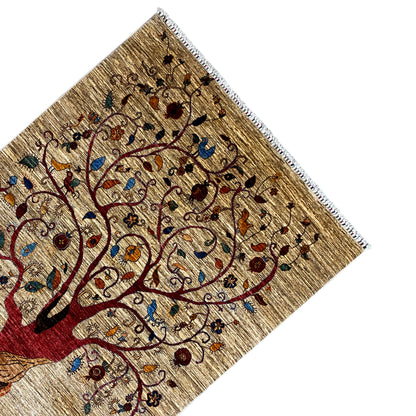 Corner of a hand-knotted rug with a tree of life motif and decorative border