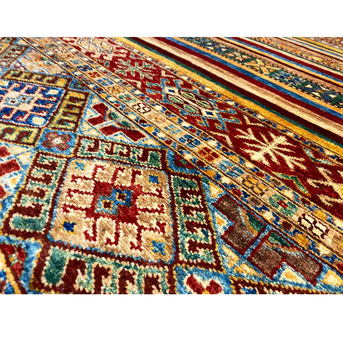 Close-up of a carpet surface with geometric patterns in bold colors