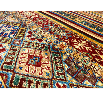 Close-up of a carpet surface with geometric patterns in bold colors