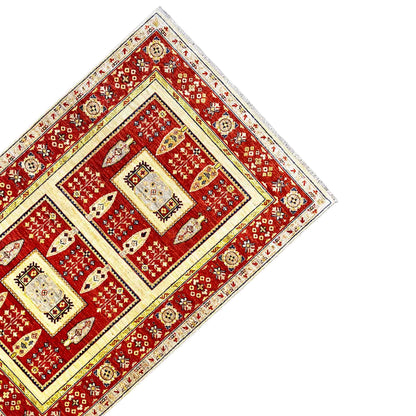 Khorjin rug photographed diagonally: red central field, cream border, and decorative medallions