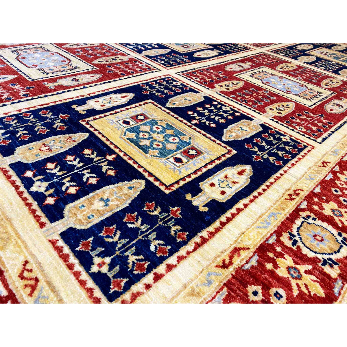 Detailed view of Khorjin rug: diamonds, medallions, and border in red and blue