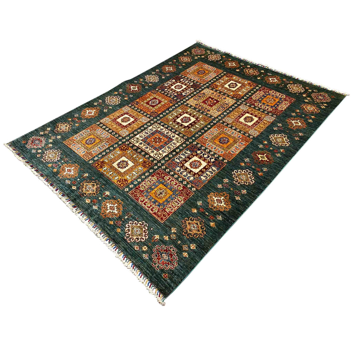 Rug with a blue-green background and orange decorative squares, fringes along the edges