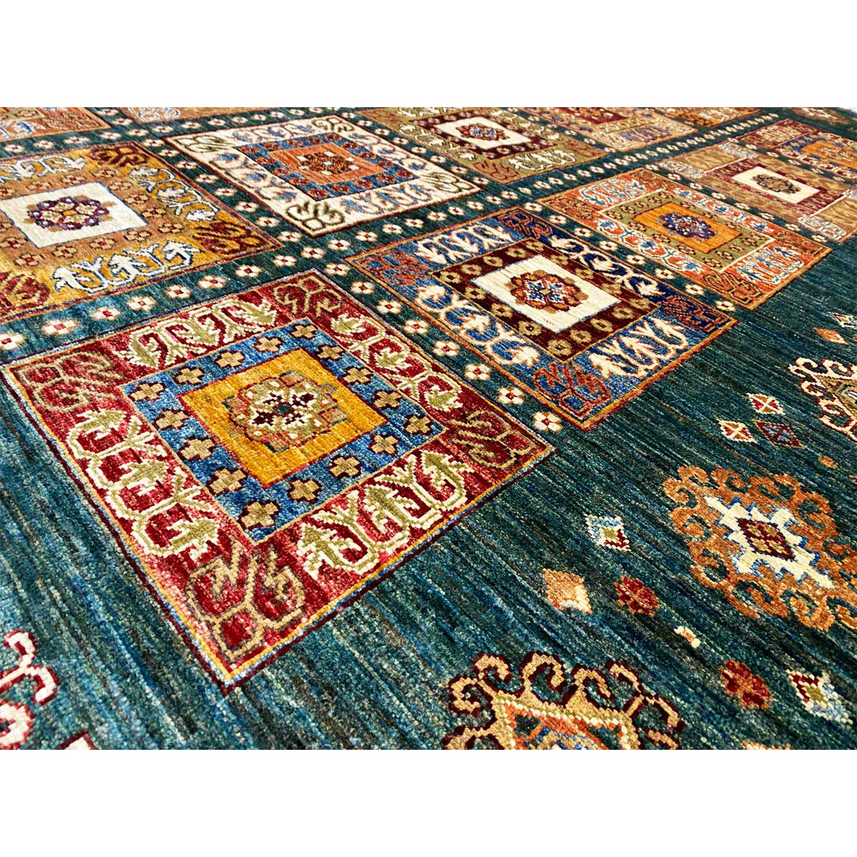 Carpet details: teal pile with colorful ornamental fields and decorative lines in the pattern