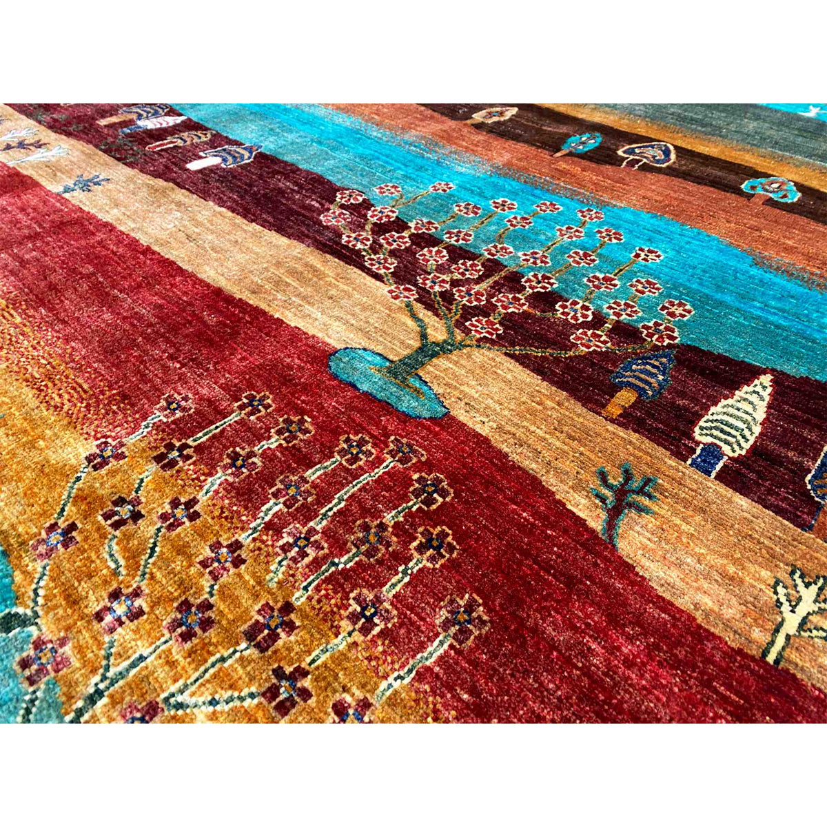 Khorjin rug detail view: Tree of Life and floral ornaments in red and turquoise