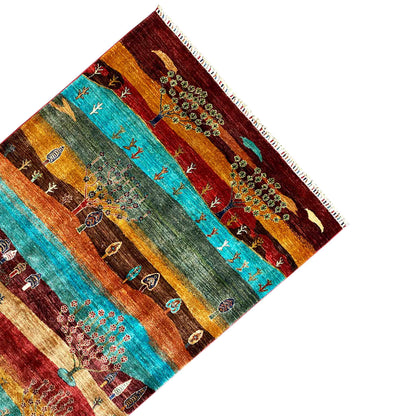 Khorjin rug corner view with tree of life motif, colorful stripes, and fringes
