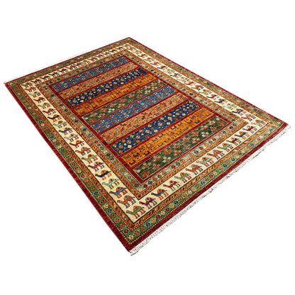Carpet shown at an angle with camel motifs along the edge and stripes in the center
