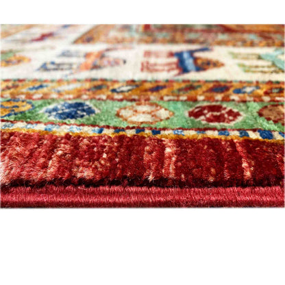 Close-up: carpet with a dense pile and multicolored pattern, red edge