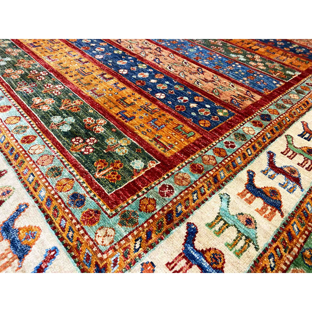 Close-up: Detail of the carpet strips with floral ornaments and camel motifs