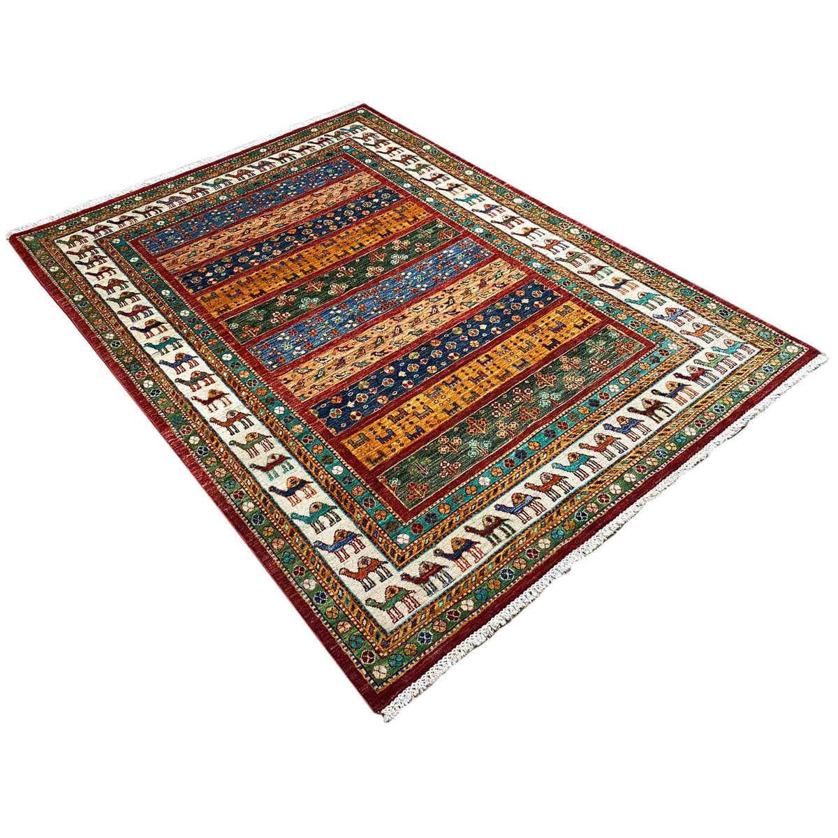 Carpet spread out with a geometric pattern, colorful border, and animal motifs along the edges