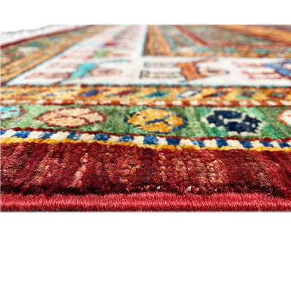 Detailed view of the carpet pile: colorful patterned areas and a bold red pile structure