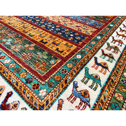 Close-up of carpet details with colored fields, ornaments, and animal motifs along the edge