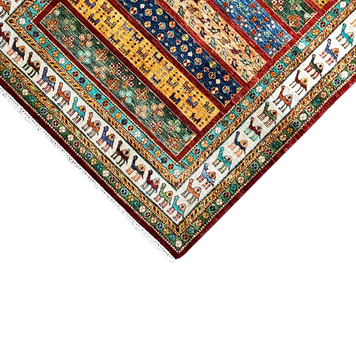 Close-up of a carpet edge with an animal-striped border and colorful ornaments