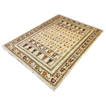 Rug with a light background, central motifs, and a dark border