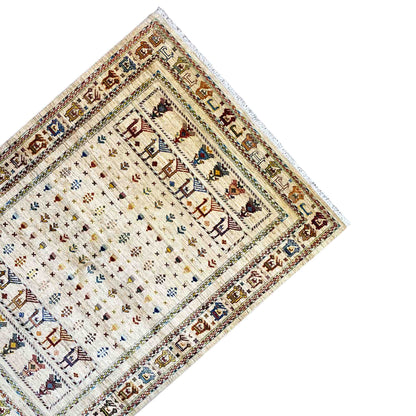 Rug corner with a light background, border lines, colorful symbols, and fringes