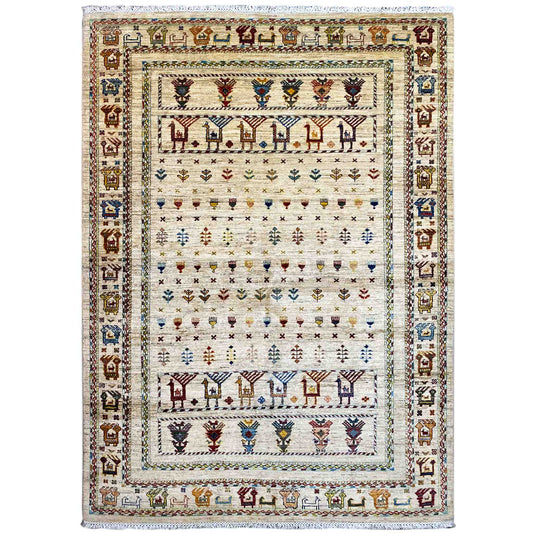 Rug with a light background and multicolored tribal motifs in the border