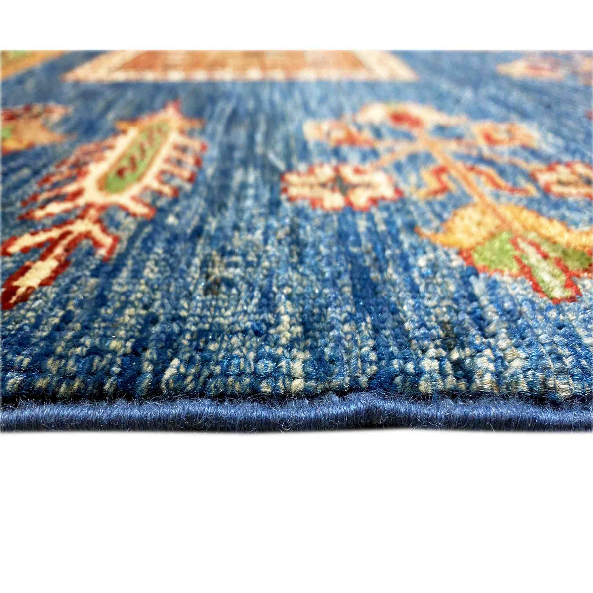 Blue carpet: close-up of the pile surface with pattern details