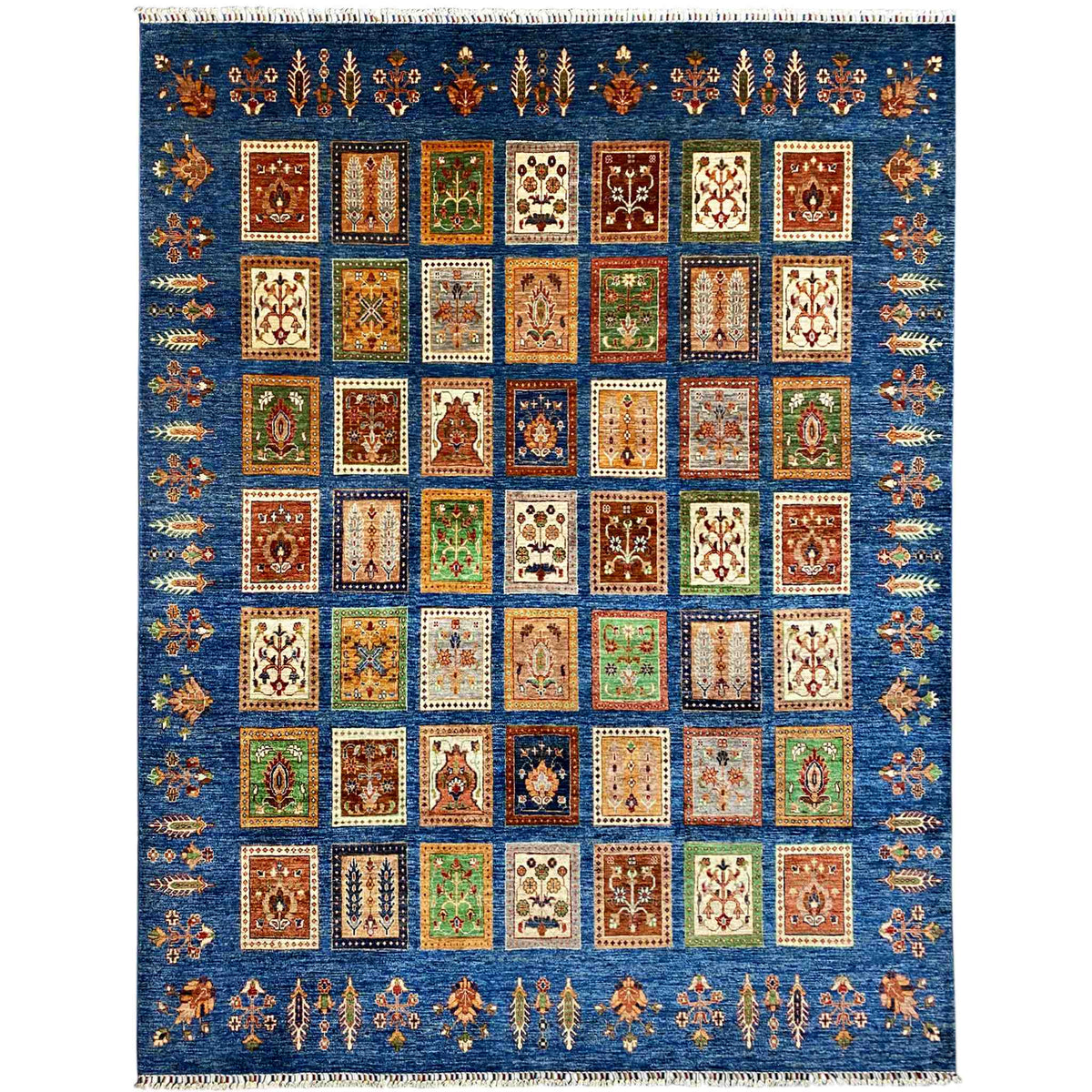 Blue rug with Khorjin panel design, colorful squares, and fringes