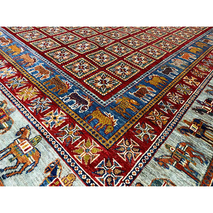 Detailed view: Khorjin rug with a red central motif, blue border, and ornamental rows