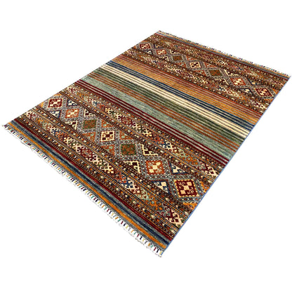Khorjin rug at an oblique angle with a row of diamonds, stripes, and fringes