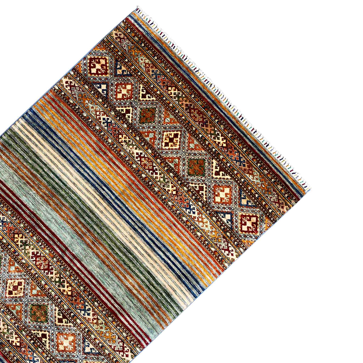 Corner view of a Khorjin rug: stripes, diamonds, and colorful fringes