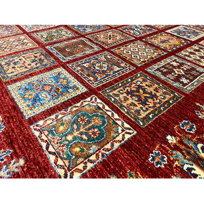 Close-up: red carpet with tile-like patterns in blue, cream, and green