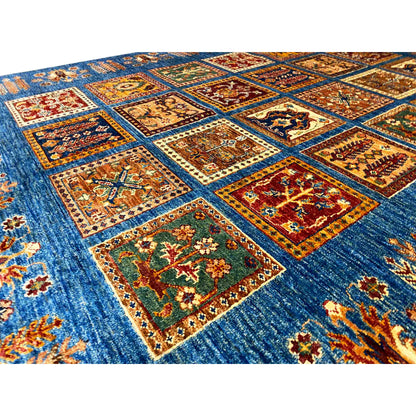 Khorjin rug close-up: blue with colorful square motifs and an ornate border pattern