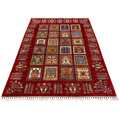 Red carpet with a central checkered pattern of colorful squares and borders, fringes