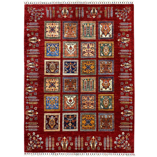Red Khorjin rug with square ornamental panels, a colorful pattern, and fringes