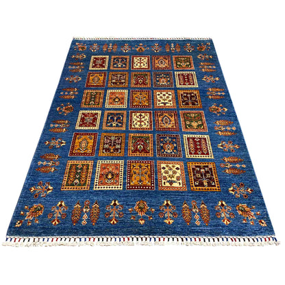 Azur-blue rug with a rectangular pattern of many squares and colorful decorative elements