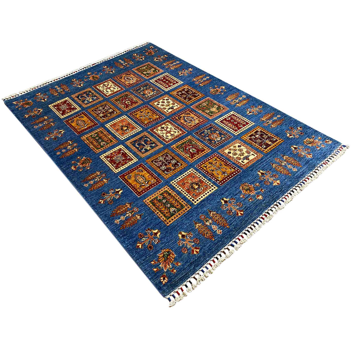 Rug, azure surface with geometric squares and a colorful patterned border along the edges