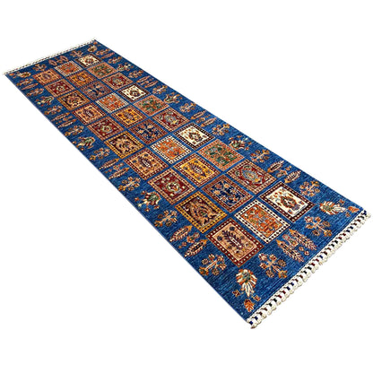 Diagonal runner rug: blue multicolored tile pattern with fringes along the edge