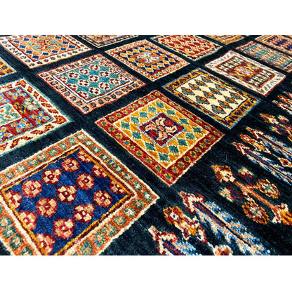 Carpet surface with a colorful square and diamond tribal pattern on a dark background