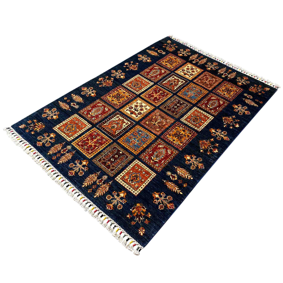Khorjin wool rug with a blue background and colorful tiled squares, diagonal view