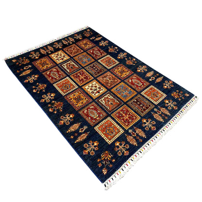 Wool Khorjin rug, dark blue with multicolored tile ornaments and white fringes