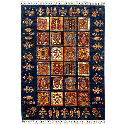 Khorjin wool rug with a dark blue background, square ornamental pattern, and fringes